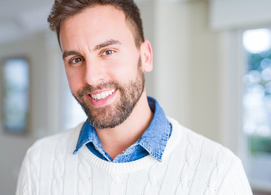 man in white sweater