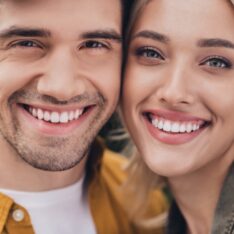 Cropped view portrait of attractive tender amorous affectionate couple bonding resting romance outdoors