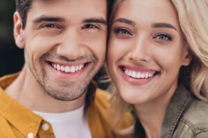 Cropped view portrait of attractive tender amorous affectionate couple bonding resting romance outdoors